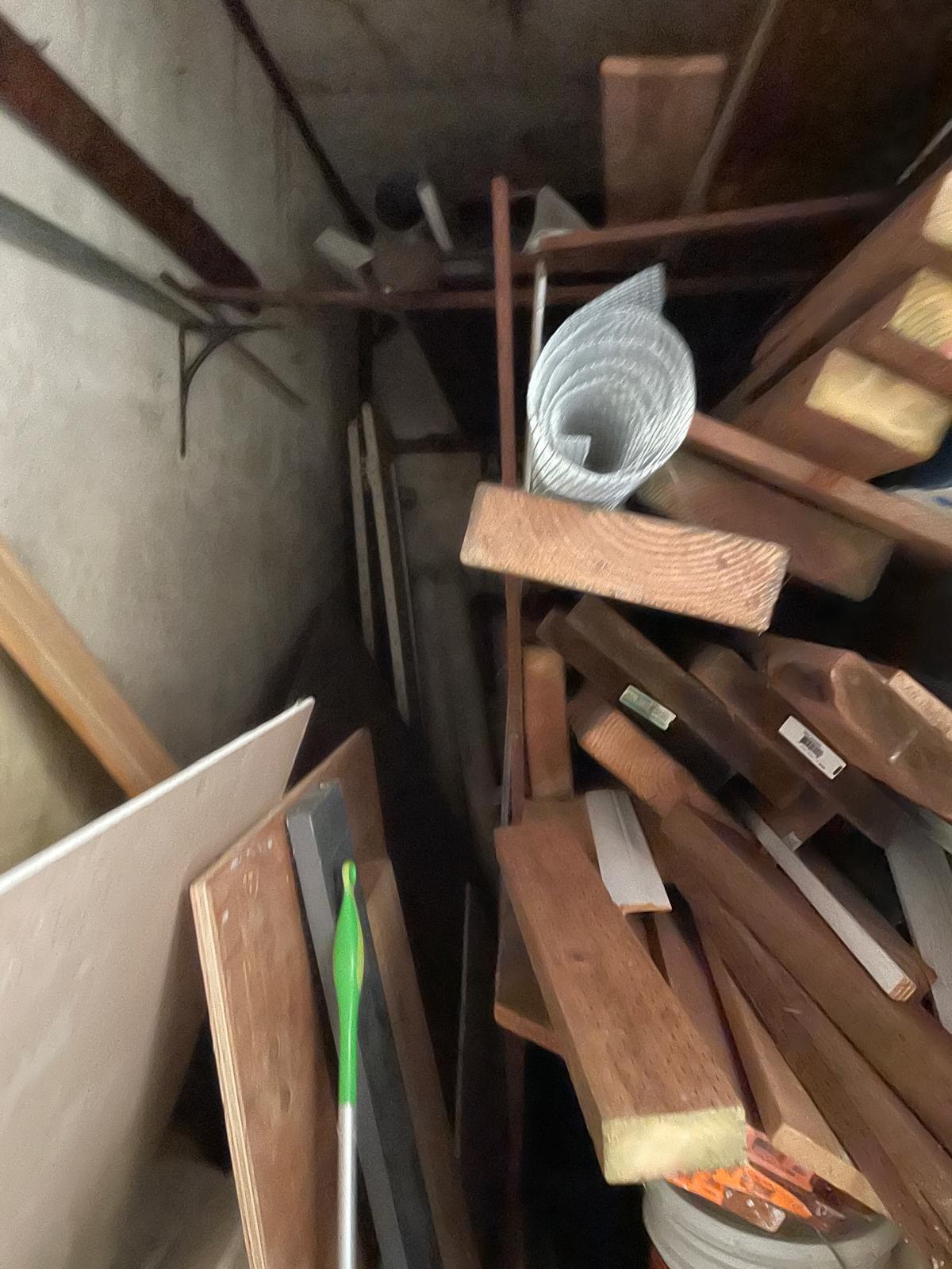 Garage cleanout with wood and clutter removal